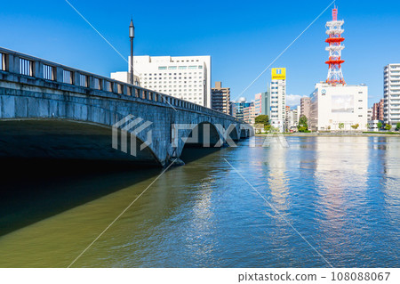 Bandai Bridge spanning the Shinano River and the cityscape of Chuo Ward, Niigata City Bandai Bridge spanning the Shinano River and the cityscape of Chuo Ward, Niigata City 108088067