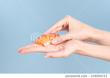 Hand with Sushi Hand with Sushi 108089141