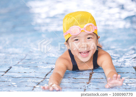girl going to the pool 108090770