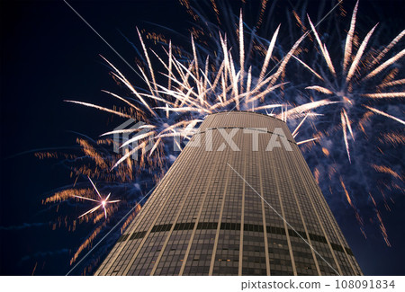 Celebratory fireworks over the Skyscrapers La Defense, commercial and business center of Paris, France 108091834