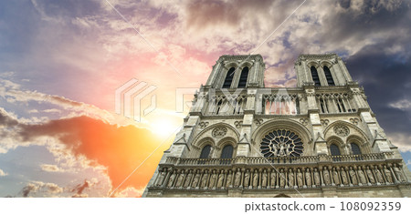 Notre Dame de Paris (against the background of a sky at sunset), also known as Notre Dame Cathedral or simply Notre Dame, is a Gothic, Roman Catholic cathedral of Paris, France Notre Dame de Paris (against the background of a sky at sunset), also known as Notre Dame Cathedral or simply Notre Dame, is a Gothic, Roman Catholic cathedral of Paris, France 108092359