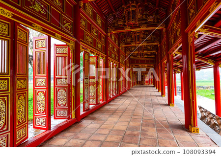 Corridor and red doors in the Forbidden Purple City of The Imperial City of Hue, Vietnam. Corridor and red doors in the Forbidden Purple City of The Imperial City of Hue, Vietnam. 108093394