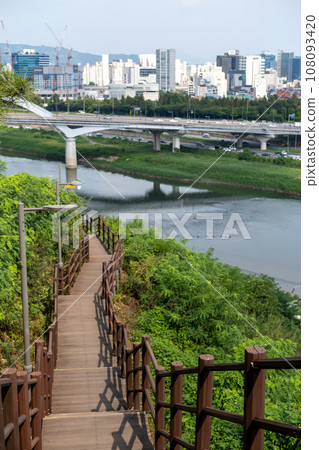 Wooden path on the mountain with view of Han river in Seoul, South Korea Wooden path on the mountain with view of Han river in Seoul, South Korea 108093420