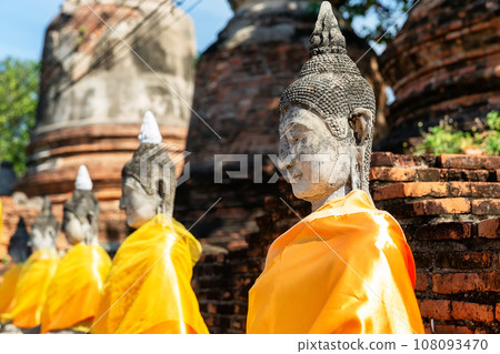 Aligned Buddha statues at Wat Yai Chai Mongkol (or Mongkhon), Ayutthaya, Thailand. 108093470