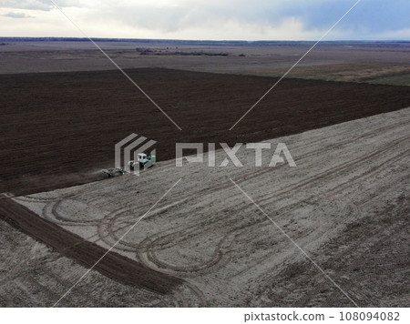 Agricultural machinery in the field, aerial view. Agricultural work. 108094082