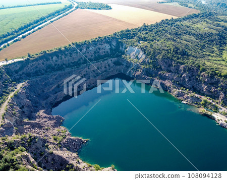 Black or Radon Lake in the Nikolaev region of Ukraine from a bird's eye view. Flooded granite quarry, aerial view, landscape. 108094128