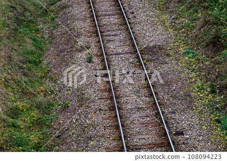Railway bed. Fragment of railway tracks, top view, rails and sleepers. Railway bed. Fragment of railway tracks, top view, rails and sleepers. 108094223