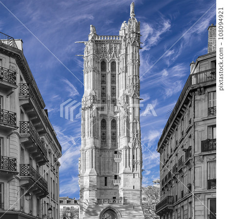 Saint-Jacques Tower (Tour Saint-Jacques) against the background of a beautiful sky with clouds. Located on Rivoli street, Paris, France. This 52 m Flamboyant Gothic tower (XVI century) 108094921