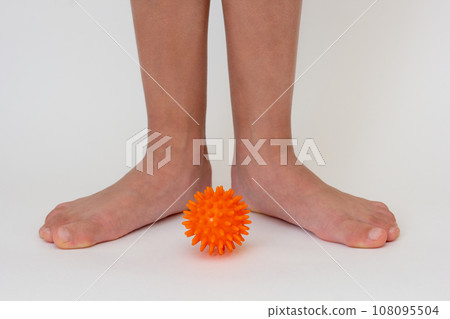 Cropped child legs and spiky needle ball  108095504