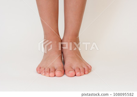 Cropped barefoot child legs Cropped barefoot child legs 108095582