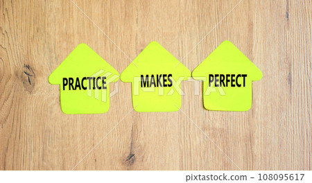 Practice makes perfect symbol. Concept words Practice makes perfect on beautiful yellow paper house. Beautiful wooden background. Business practice makes perfect concept. Copy space. 108095617