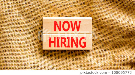Now hiring symbol. Concept words Now hiring on beautiful wooden block. Beautiful canvas table canvas background. Business marketing, motivational now hiring concept. Copy space. 108095773