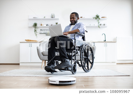 Freelancer in wheelchair leading comfortable lifestyle by using tech gadgets Freelancer in wheelchair leading comfortable lifestyle by using tech gadgets 108095967