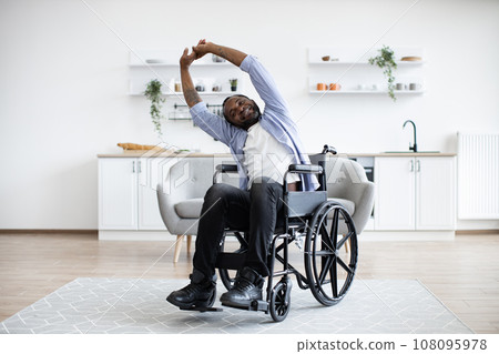 Person with disability working out at home 108095978
