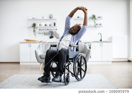 Person with disability working out at home Person with disability working out at home 108095979