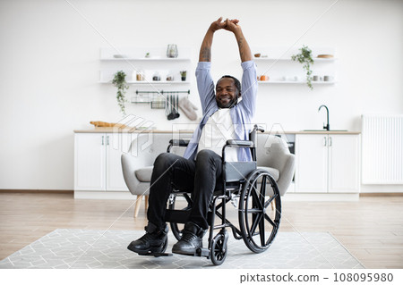 Person with disability working out at home 108095980