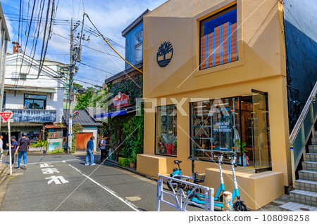 Tokyo, Shibuya Ward, Daikanyama cityscape, street lined with stylish shops Tokyo, Shibuya Ward, Daikanyama cityscape, street lined with stylish shops 108098258