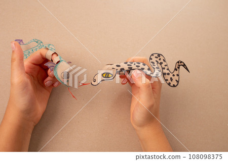 a snake or dragon made out of recycled paper, DIY, tutorial, educational art and craft for kids, 108098375