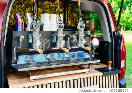 Professional Coffee Machine Installed in the Back of a Car: Coffee Service for Outdoor Events Professional Coffee Machine Installed in the Back of a Car: Coffee Service for Outdoor Events 108100391