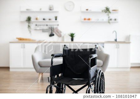 Empty wheelchair in the kitchen. Lonely and healthcare concept 108101047