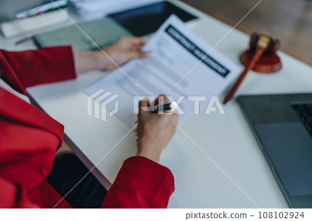 The lawyer with a client discussing contract paper, a Business lawyer working about legal legislation in the courtroom to help their customer, contract and agreement concept 108102924
