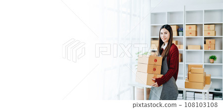 Asian female business owner handles delivery of orders to customers. Asian female business owner handles delivery of orders to customers. 108103108