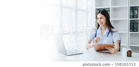 The doctor is checking the patient's history before giving treatment. 108103153