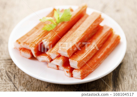 Crab sticks on white plate. 108104517