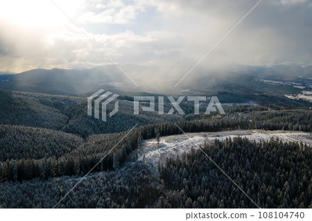 Winter landscape with spruse trees of snow covered forest in cold mountains. Winter landscape with spruse trees of snow covered forest in cold mountains. 108104740