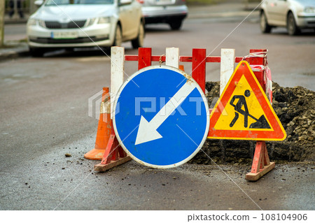Warning street sign on road work site. 108104906