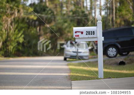 Typical american outdoors mail box on suburban street side 108104955