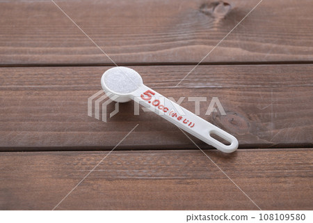 1/2 teaspoon salt with a measuring spoon 108109580