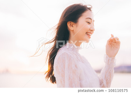 Beauty image with sunset background 108110575