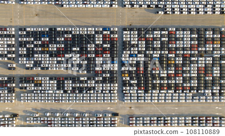 Aerial view new ev car on car park, Ev car loading, EV new cars stock at factory parking lot, Automotive industry, Logistics business. Import or export new cars at warehouse, Parking lot at port 108110889