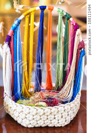 Many multicolored silk thread prepared for making picture embroidery in vietnamese culture Many multicolored silk thread prepared for making picture embroidery in vietnamese culture 108111494