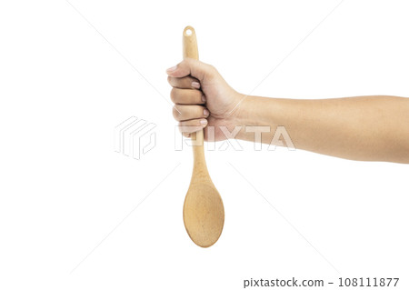 Human hand holding wooden spoon Human hand holding wooden spoon 108111877