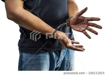 Arrested man with a handcuff on his hand Arrested man with a handcuff on his hand 108111925