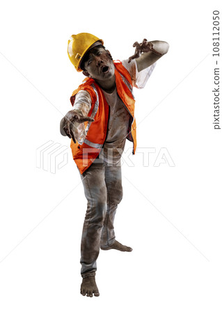 A scary construction worker zombie with blood and wounds on his body walking 108112050