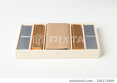 Chocolate candies in box on white background 108113669
