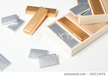 Chocolate candies in foil and in box on white background 108113670