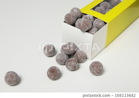 Chocolate candies in box on white background, close up Chocolate candies in box on white background, close up 108113682