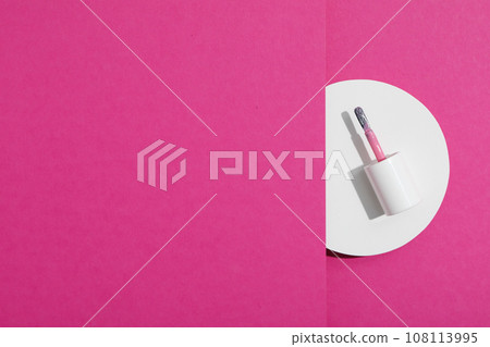 Nail polish brush on a pink background Nail polish brush on a pink background 108113995