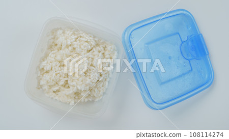 Frozen rice in a plastic container Frozen rice in a plastic container 108114274