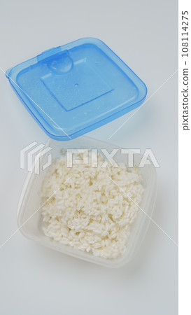 Frozen rice in a plastic container Frozen rice in a plastic container 108114275