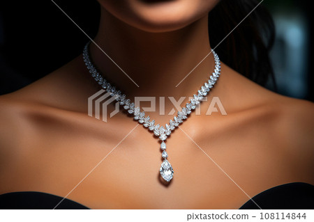 Woman wearing luxury jewelry, platinum necklace with diamonds close-up. Golden necklace on female neck. Beautiful diamond pendant necklace. Beauty, people and jewelry concept 108114844