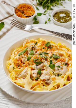 creamy chicken and mushroom tagliatelle in bowl creamy chicken and mushroom tagliatelle in bowl 108115101