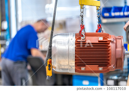 electric motor hung on the production line in the factory 108117010
