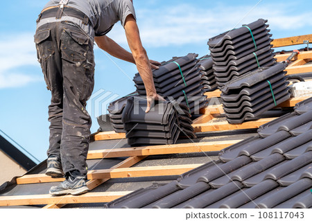 ceramic tiles on the roof, installation of a new roof by an expert 108117043