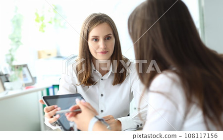 Pretty business lady at workplace Pretty business lady at workplace 108117156