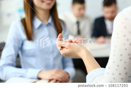 Focus on beautiful woman arm holding writing pen. 108117203